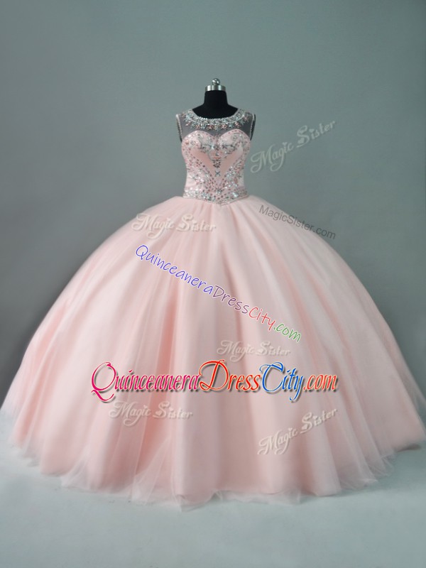 blush pink quinceanera dress,with the color blush pink for quinceanera dress,cute pink quinceanera dress,pinkish quinceanera dress,pretty pink quinceanera dress,quinceanera designer dress pink,illusion neckline quinceanera dress,tulle under quinceanera dress,zipper quinceanera dress,rhinestone quinceanera dress,sheer top quinceanera dress,scoop quinceanera dress,